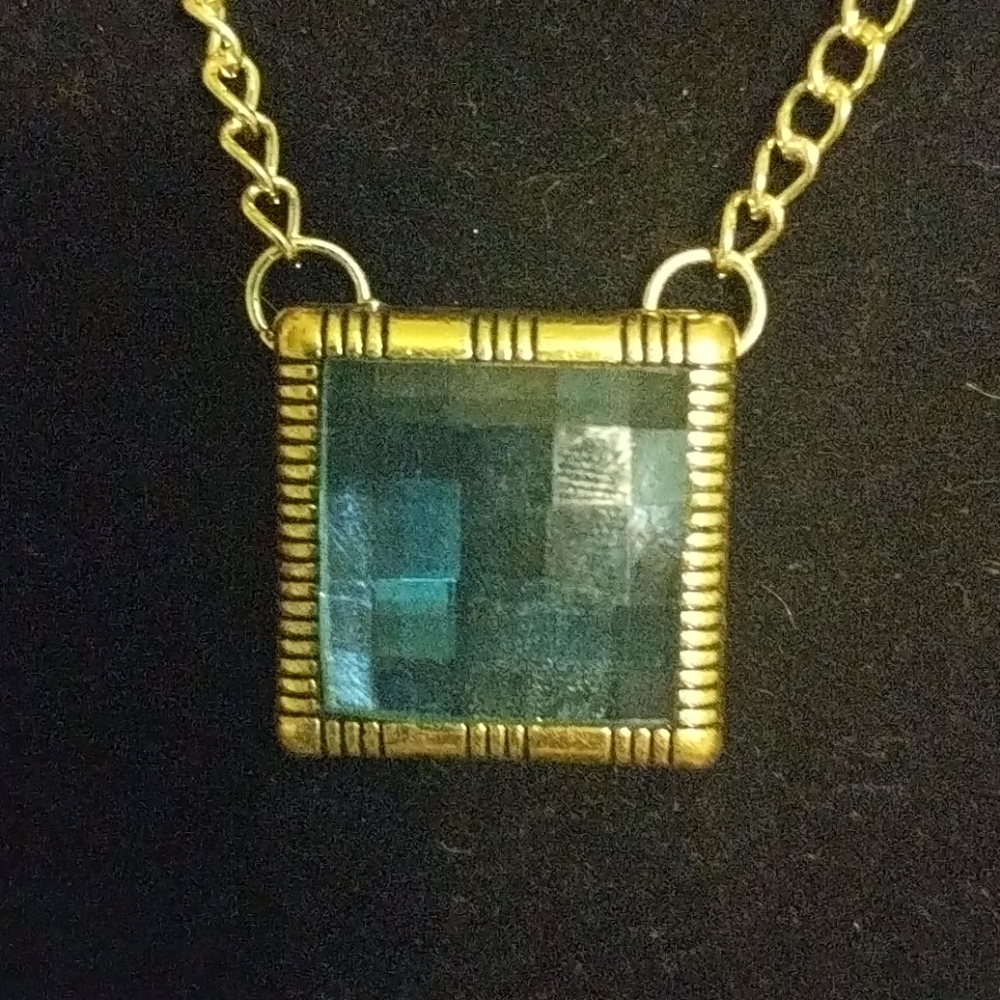 Highly Faceted Green Glass piece on 18 inch chain